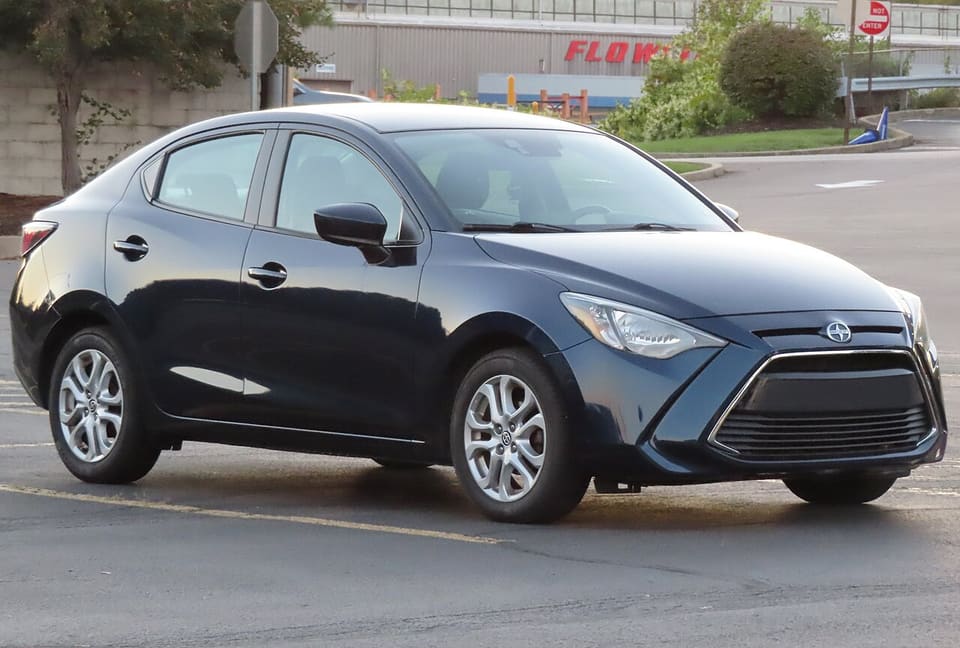 Dark blue 2016 Scion iA sedan, front three-quarter view