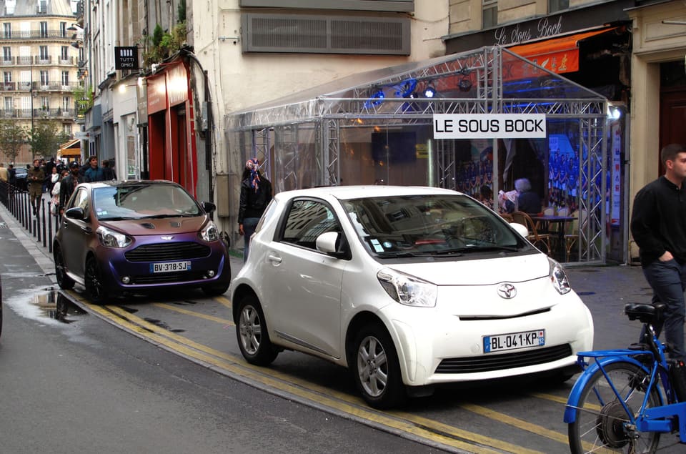 White Toyota iQ city car at a London street